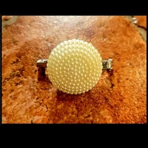 THE CLASSIC  LADY LOOK IN THIS PEARLIZED  ACCENT FASHION ACCESSORY  BROOCH